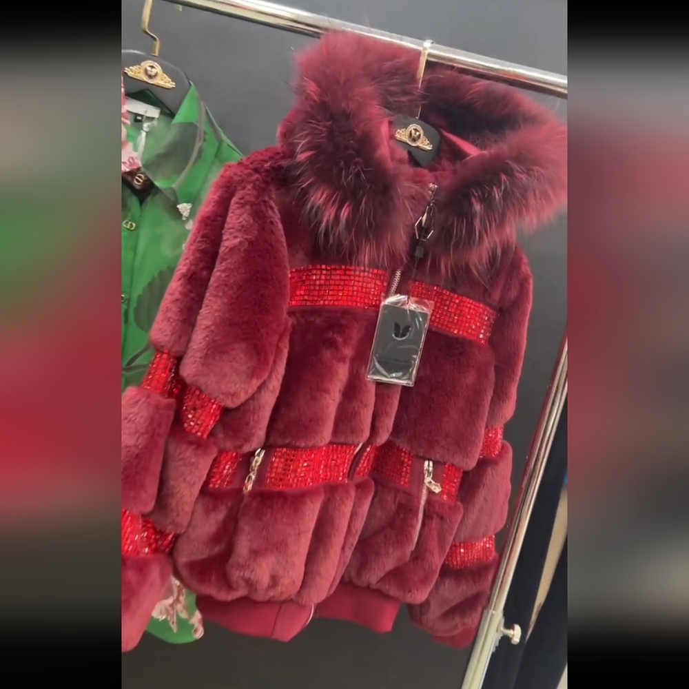 Faux fur jacket. Burgundy color. Decorated with crystals. Detached hood.